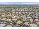 Picturesque aerial perspective capturing a serene residential area with lush greenery and varied rooflines at 3000 Hammerwood Dr, Las Vegas, NV 89135