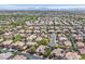 Great aerial view of a neighborhood with well-manicured lawns, mature trees, and beautiful single-Gathering homes at 3000 Hammerwood Dr, Las Vegas, NV 89135