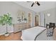 Bright bedroom with wood floors, stylish furniture, and ensuite bathroom at 3000 Hammerwood Dr, Las Vegas, NV 89135