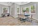 Bright breakfast nook with natural light, large windows, and seating for four at 3000 Hammerwood Dr, Las Vegas, NV 89135