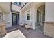 Cozy front entrance with seating area, decorative fountain, and wrought iron door at 3000 Hammerwood Dr, Las Vegas, NV 89135