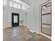 Grand foyer with high ceilings, a decorative front door, and stylish tile flooring at 3000 Hammerwood Dr, Las Vegas, NV 89135