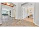 Bright hallway with tile floors and neutral walls connecting various rooms at 3000 Hammerwood Dr, Las Vegas, NV 89135