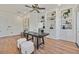 Bright home office featuring custom built-ins, hardwood floors and ample workspace for a work-from-home environment at 3000 Hammerwood Dr, Las Vegas, NV 89135