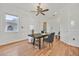 Bright home office with wood floors, neutral decor, and window with view of courtyard at 3000 Hammerwood Dr, Las Vegas, NV 89135