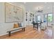 Well-lit home office with wood floors, built-in shelving, and desk at 3000 Hammerwood Dr, Las Vegas, NV 89135