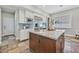 Bright kitchen features granite counters, stainless appliances, and a center island at 3000 Hammerwood Dr, Las Vegas, NV 89135