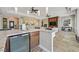 A kitchen bar features stone countertops and backsplash, pendant lights, and a wine refrigerator at 3000 Hammerwood Dr, Las Vegas, NV 89135