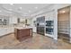 Bright kitchen features granite counters, stainless appliances, and a center island at 3000 Hammerwood Dr, Las Vegas, NV 89135