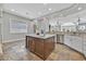 Bright kitchen features granite counters, stainless appliances, and a center island at 3000 Hammerwood Dr, Las Vegas, NV 89135