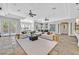Spacious living room with contemporary furnishings and large windows overlooking the backyard at 3000 Hammerwood Dr, Las Vegas, NV 89135