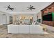 Inviting living room featuring a large entertainment center and open access to the kitchen at 3000 Hammerwood Dr, Las Vegas, NV 89135