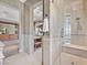 Spa-like main bathroom with walk-in shower, soaking tub, and dual vanities at 3000 Hammerwood Dr, Las Vegas, NV 89135