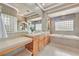 Luxurious main bathroom with dual vanities, soaking tub, and neutral color palette at 3000 Hammerwood Dr, Las Vegas, NV 89135