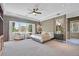Elegant main bedroom with sitting area, plush carpet, and serene decor at 3000 Hammerwood Dr, Las Vegas, NV 89135