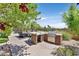 Outdoor kitchen and dining area with a built-in grill, sink, and bar, perfect for entertaining and outdoor cooking at 3000 Hammerwood Dr, Las Vegas, NV 89135