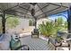 Cozy outdoor seating area under a gazebo, perfect for relaxing and enjoying the peaceful backyard setting at 3000 Hammerwood Dr, Las Vegas, NV 89135