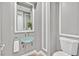 Elegant powder room with glass vessel sink, neutral colors, and modern fixtures at 3000 Hammerwood Dr, Las Vegas, NV 89135