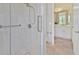 Modern shower with glass door, marble surround, and view to ensuite bathroom at 3000 Hammerwood Dr, Las Vegas, NV 89135