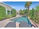 Inviting swimming pool with sun loungers, perfect for relaxation and enjoying the outdoor living space at 3000 Hammerwood Dr, Las Vegas, NV 89135