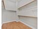 Unfurnished walk-in closet with wood floors and rod and shelf system at 3000 Hammerwood Dr, Las Vegas, NV 89135