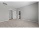 Neutral bedroom with carpet, two doorways, and natural lighting, ready for personalization at 3236 Lahontan St, North Las Vegas, NV 89032