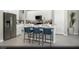 Bright, modern kitchen featuring white cabinets, stainless steel appliances, and a breakfast bar with seating at 326 Parawan St # Lot 19, Henderson, NV 89015