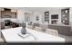 Bright living area featuring a fireplace, built-in shelving and a kitchen with stainless appliances at 329 Blossom Wind St # Lot 14, Henderson, NV 89015