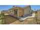 The backyard features a covered patio and xeriscaping with a privacy wall, providing a low-maintenance, stylish outdoor space at 335 Simon Bolivar Dr, Henderson, NV 89014