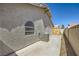 This backyard features a concrete patio area and wall, ideal for outdoor entertaining and relaxation at 335 Simon Bolivar Dr, Henderson, NV 89014