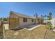 The backyard features xeriscaping and a partially covered patio, offering a low-maintenance outdoor living space at 335 Simon Bolivar Dr, Henderson, NV 89014