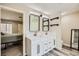 Stylish bathroom boasting a dual sink vanity, modern mirrors and updated lighting at 335 Simon Bolivar Dr, Henderson, NV 89014