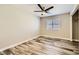 Cozy bedroom with wood-look flooring, a ceiling fan, and a closet at 335 Simon Bolivar Dr, Henderson, NV 89014