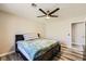 A simple bedroom with a stylish ceiling fan provides a comfortable space to sleep at 335 Simon Bolivar Dr, Henderson, NV 89014