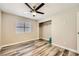 Bright bedroom featuring wood-look flooring, a ceiling fan, and a closet at 335 Simon Bolivar Dr, Henderson, NV 89014