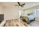 A simple bedroom with wood grain floors, recessed lighting and neutral walls at 335 Simon Bolivar Dr, Henderson, NV 89014