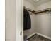 Spacious walk-in closet featuring ample storage and organized shelving with a grey wood-look floor at 335 Simon Bolivar Dr, Henderson, NV 89014