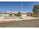 Single-story home featuring desert landscaping, a two-car garage, and a quaint front entryway at 335 Simon Bolivar Dr, Henderson, NV 89014