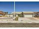 Single-story home featuring desert landscaping, a two-car garage, and a quaint front entryway at 335 Simon Bolivar Dr, Henderson, NV 89014