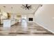 An open floorplan with a modern kitchen, fireplace, and sliding glass doors to the outside at 335 Simon Bolivar Dr, Henderson, NV 89014