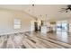 Spacious living room with modern floors and open view of kitchen at 335 Simon Bolivar Dr, Henderson, NV 89014