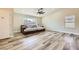 Spacious living room featuring luxury vinyl plank flooring, neutral paint, and modern ceiling fan at 335 Simon Bolivar Dr, Henderson, NV 89014