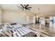 Open floorplan living room showcases vaulted ceiling with modern ceiling fan and view of kitchen at 335 Simon Bolivar Dr, Henderson, NV 89014