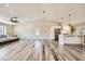 Large living room with vaulted ceilings, modern ceiling fan, and open floorplan at 335 Simon Bolivar Dr, Henderson, NV 89014