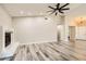 Living room showing a fireplace, wood grain floors, and neutral colored walls at 335 Simon Bolivar Dr, Henderson, NV 89014