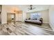 Spacious living room featuring luxury vinyl plank flooring, neutral paint, and modern ceiling fan at 335 Simon Bolivar Dr, Henderson, NV 89014