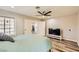 Spacious main bedroom featuring a ceiling fan, wood-look floors, and natural light at 335 Simon Bolivar Dr, Henderson, NV 89014