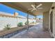 This covered patio overlooks a xeriscaped backyard with a privacy wall providing an ideal outdoor living space at 335 Simon Bolivar Dr, Henderson, NV 89014