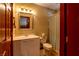 Well-lit bathroom with a single sink vanity and a shower/tub combination with a curtain at 401 Alpine Way, Las Vegas, NV 89124