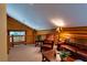 Inviting loft area showcasing log walls, cozy seating, and rustic décor at 401 Alpine Way, Las Vegas, NV 89124